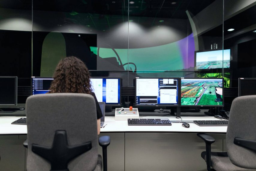 woman sitting at desk working on computer